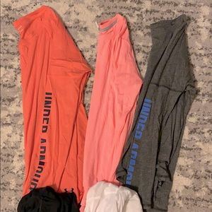 Assortment of long sleeve under armor tops